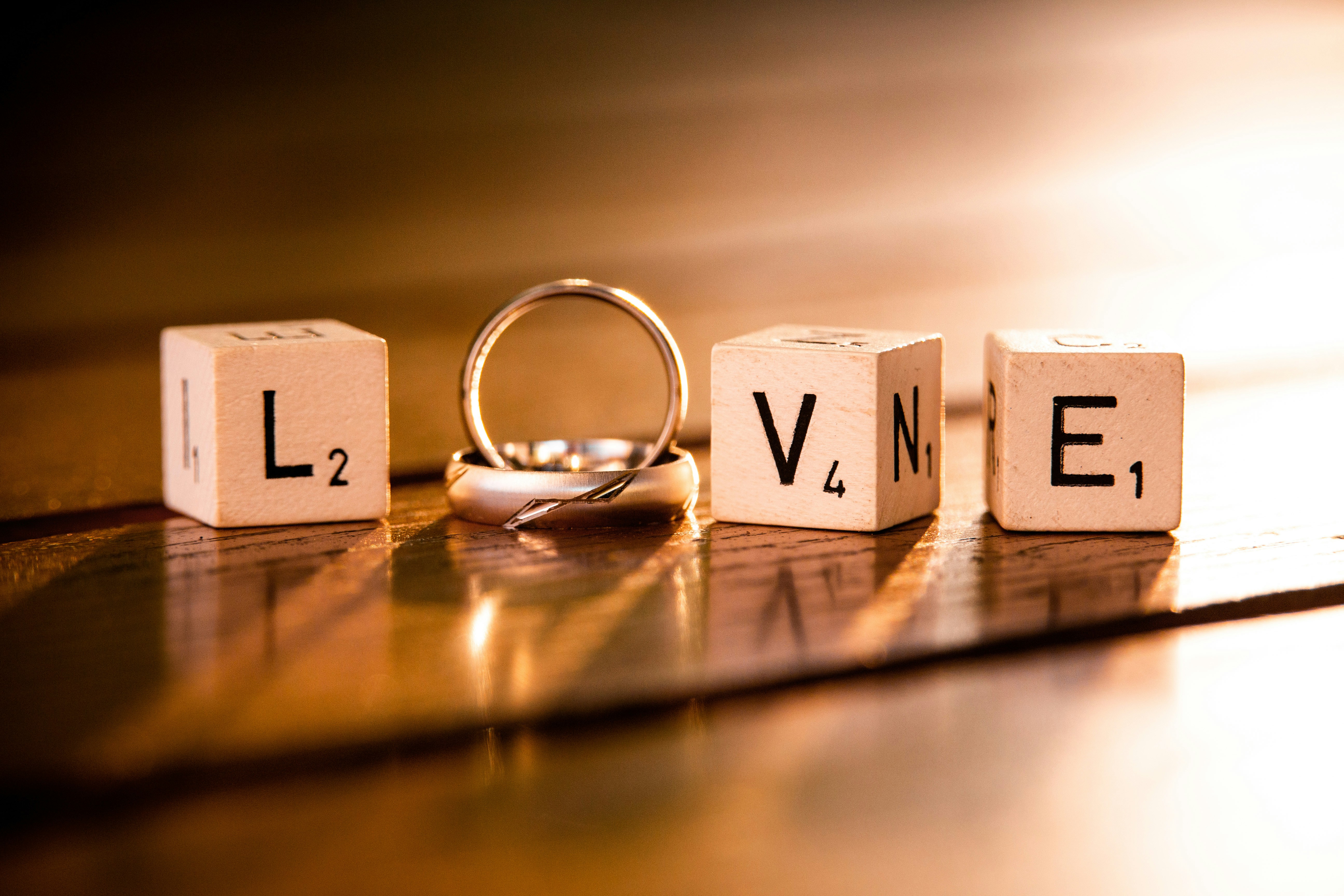 A set of dice and a ring that spells Love